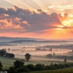 Imagem serena de um amanhecer, com nuvens suaves e luz brilhando, simbolizando esperança e renovação.