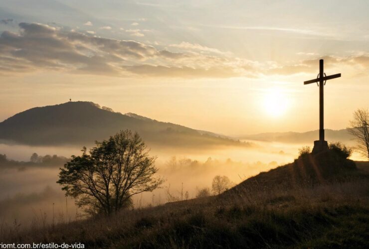 Nascer do sol sereno com uma cruz no horizonte representando renovação espiritual