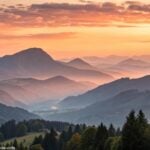 Nascer do sol sereno sobre montanhas calmas simbolizando inspiração e força