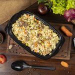 plov rice garnish with vegetables carrots chestnuts and beef pieces