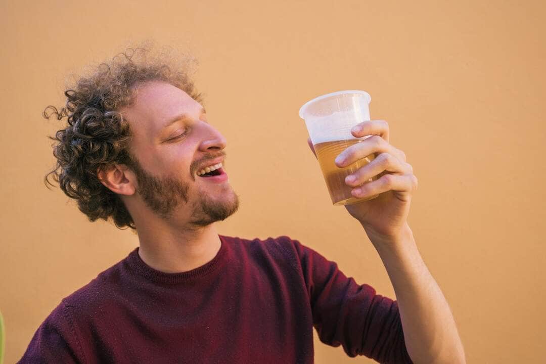 Woman Drinking Beer Outdoors - Fotos do Canva