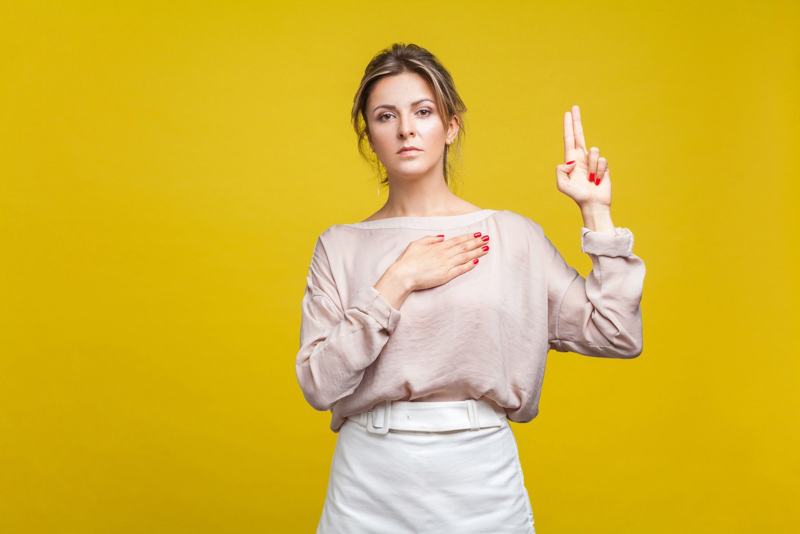 Emotional Beautiful Woman on Yellow Background. - Fotos do Canva